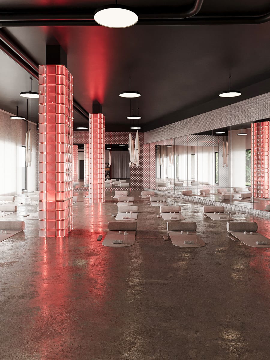 La salle Restore de Studio MA plongée dans la lumière rouge.
